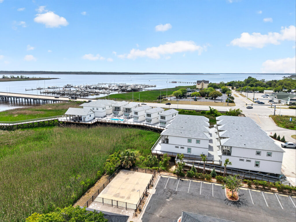 Aerial view of Winyah Bay Club townhomes and marina along the water