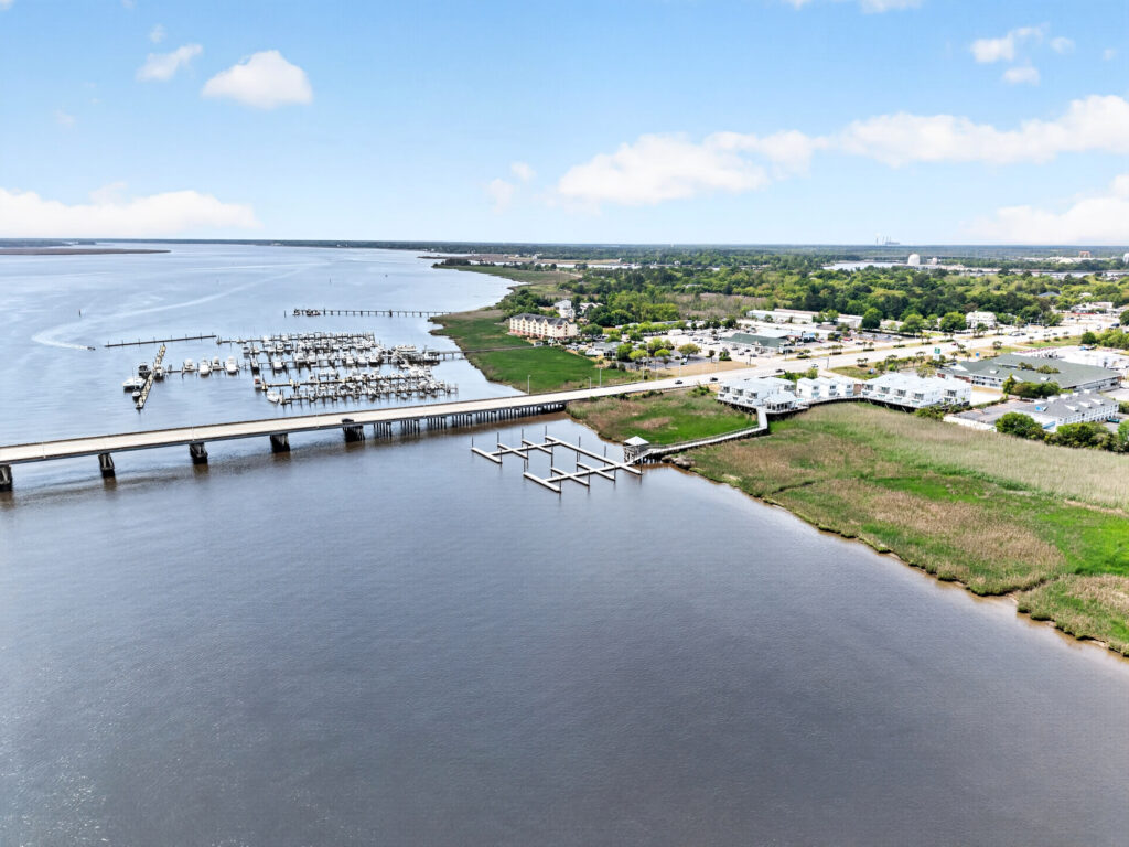Aerial view of Winyah Bay Club marina docks and waterfront community