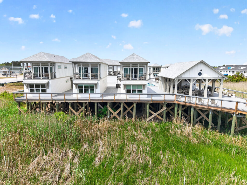 Winyah Bay Club waterfront townhomes with elevated decks over marsh grass