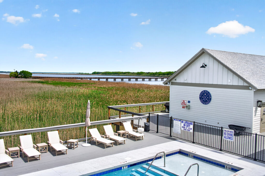 Winyah Bay Club waterfront deck with lounge chairs overlooking the marsh