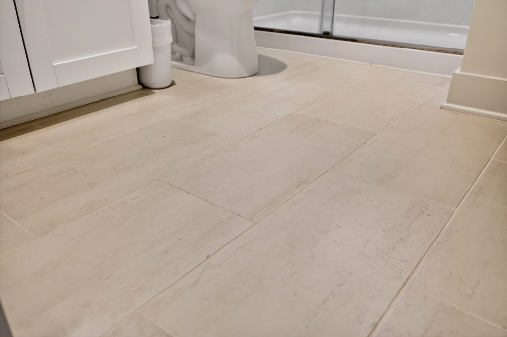 Close-up of large-format beige floor tile at Winyah Bay Club, tile by J&S Flooring in Georgetown, SC