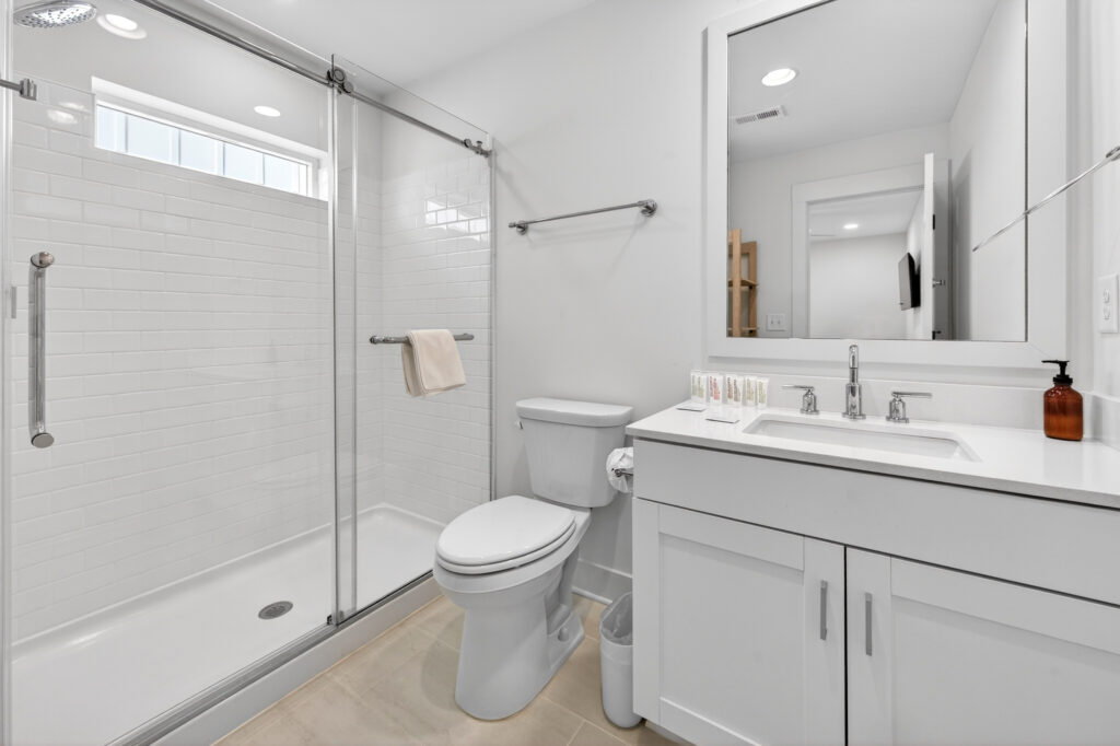 Winyah Bay Club bathroom with glass shower and vanity