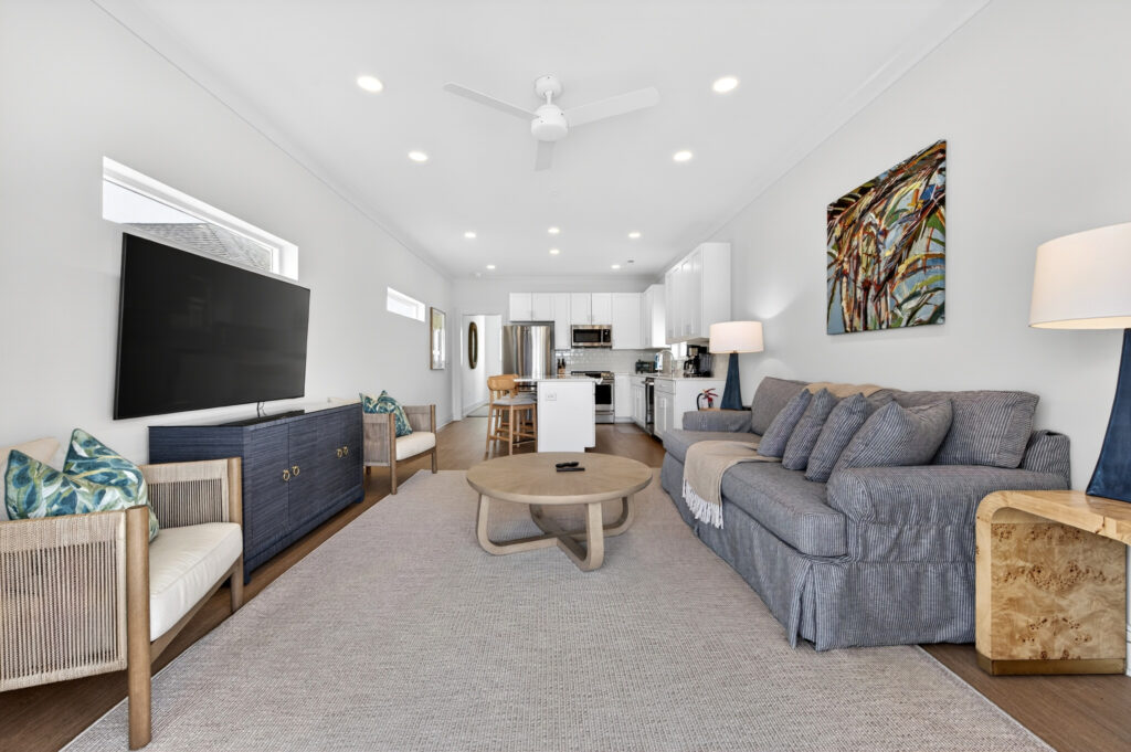 Winyah Bay Club living room with blue media console and gray sofa