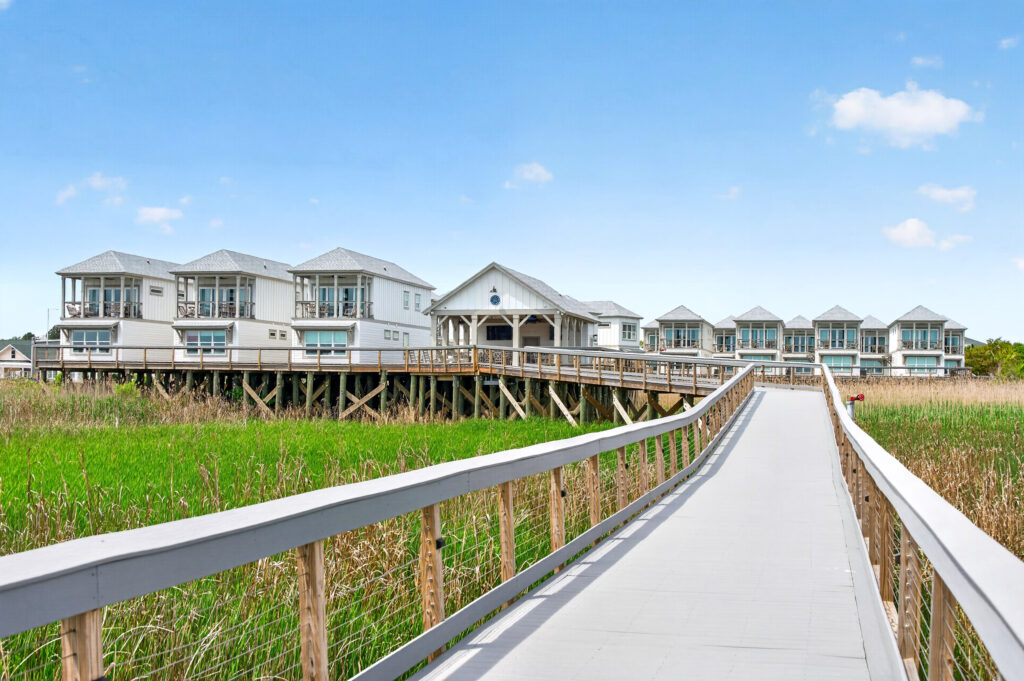 Winyah Bay Club townhomes along a boardwalk through the marsh