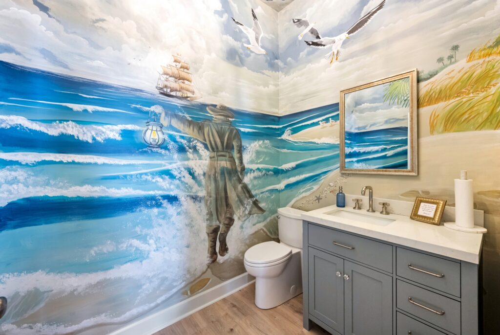 Gray Man Gallery ocean mural wall above gray cabinet