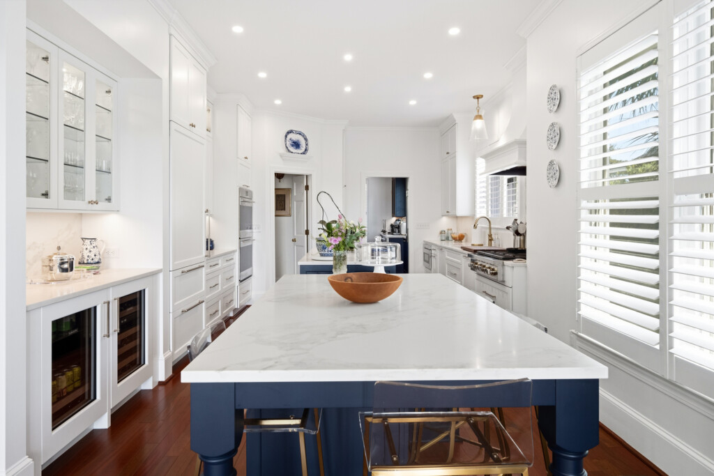 Colony Point kitchen island and butler's pantry with hardwood flooring beyond