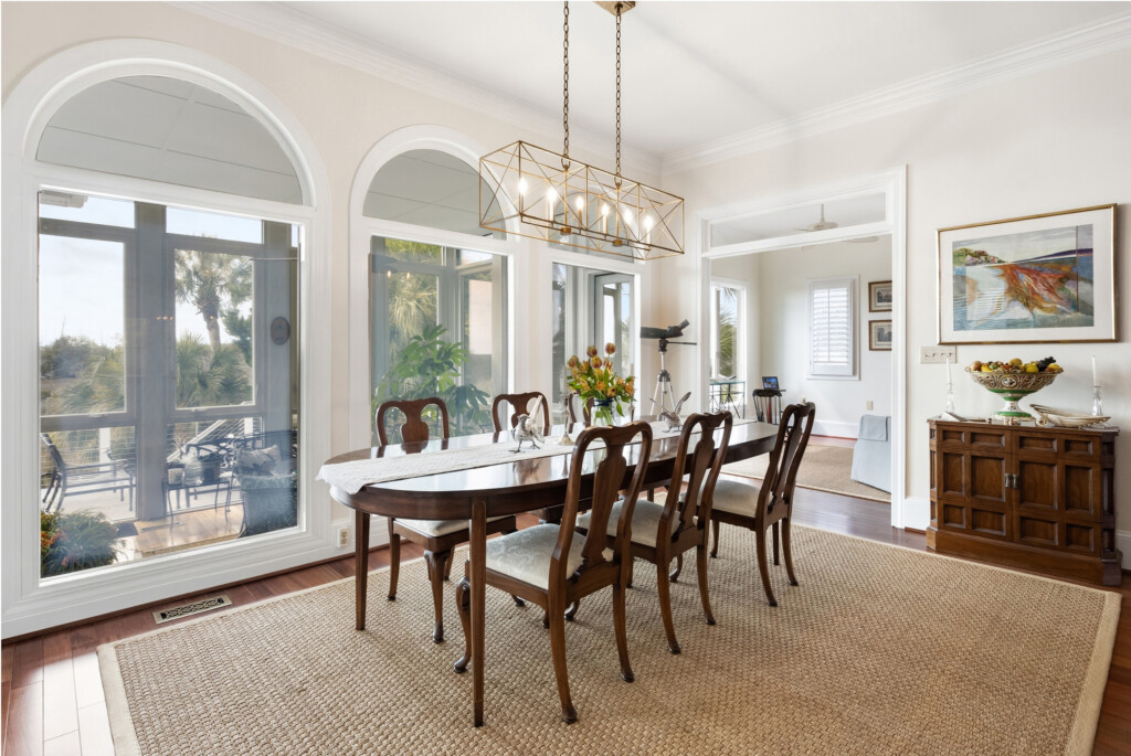 Colony Point formal dining room with arched windows and hardwood flooring by J&S Flooring in Georgetown, SC