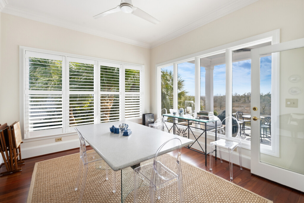 Colony Point breakfast area with white table and window views