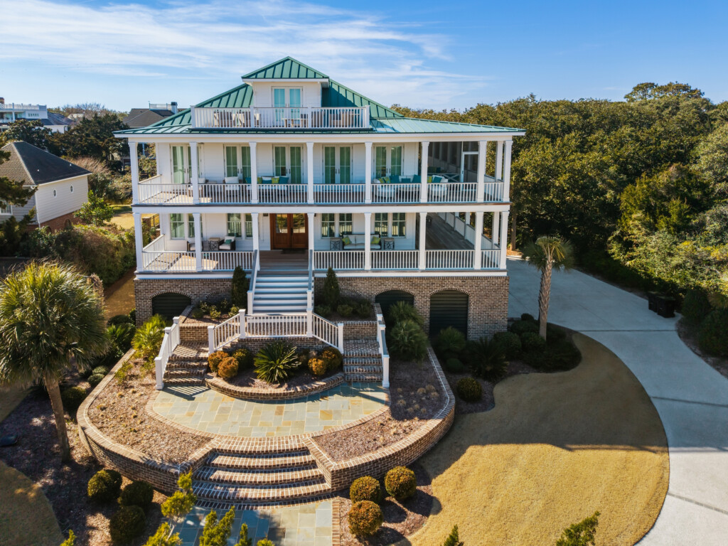 Aerial view of DeBordieu custom home with front staircase and circular drive