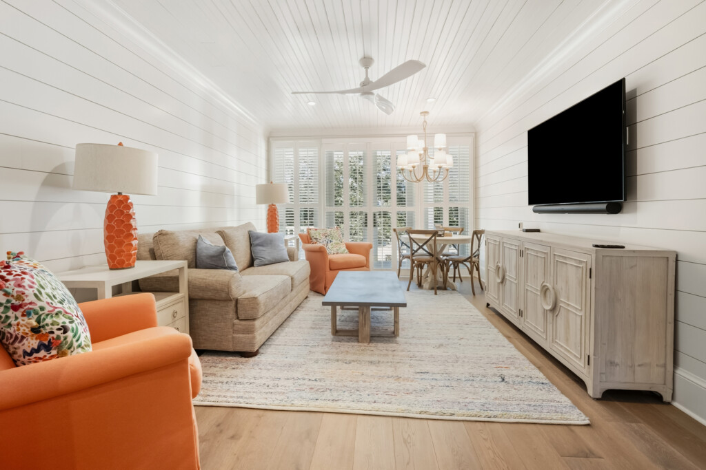 DeBordieu living room with orange accent chairs and sofa