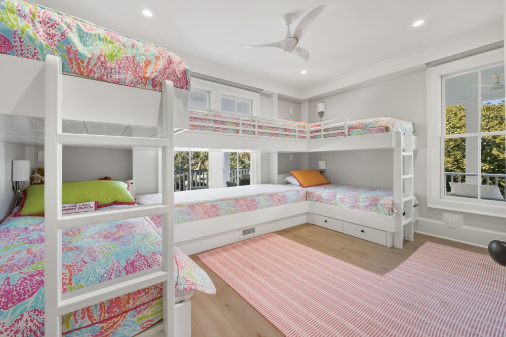 DeBordieu bunk room with built-in bunk beds and pink floral bedding