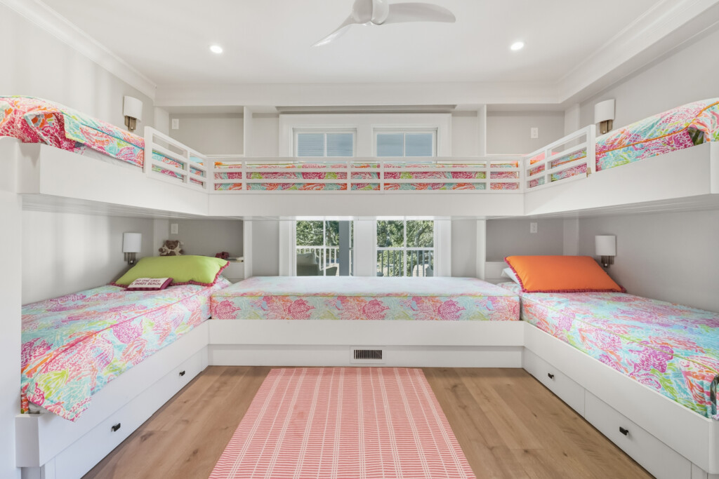 DeBordieu bunk room with built-in bunk beds and colorful pillows