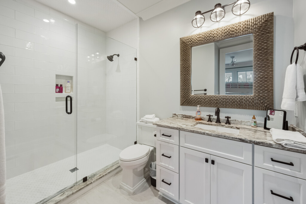 DeBordieu bathroom with glass shower and shiplap walls