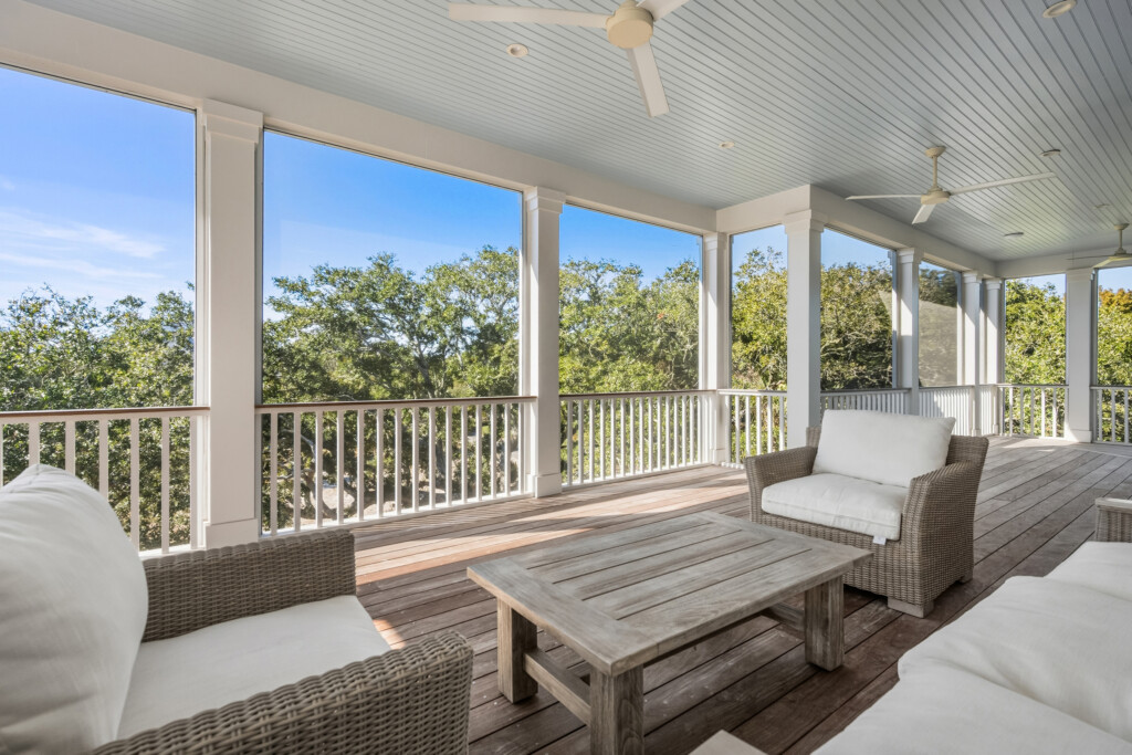 DeBordieu screened porch with wicker seating and wood decking