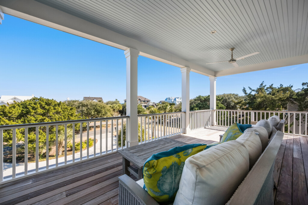DeBordieu porch seating area with colorful cushions