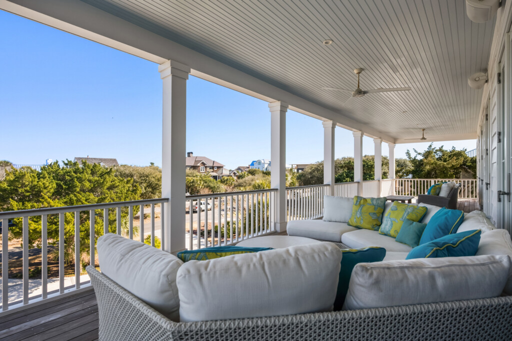 DeBordieu porch lounge seating with teal and green pillows