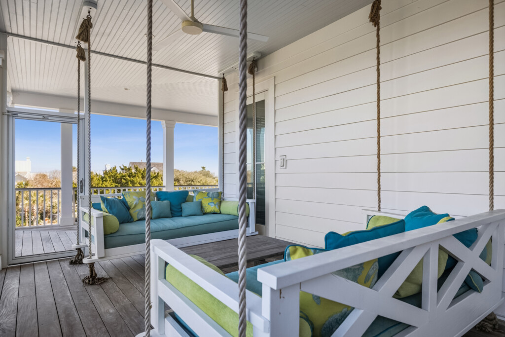 DeBordieu porch daybed seating with teal cushions