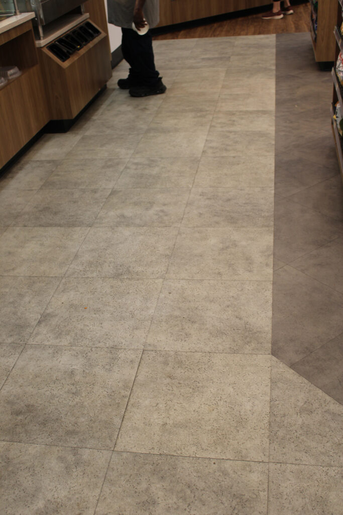 Gray stone-look commercial flooring at Refuel Georgetown