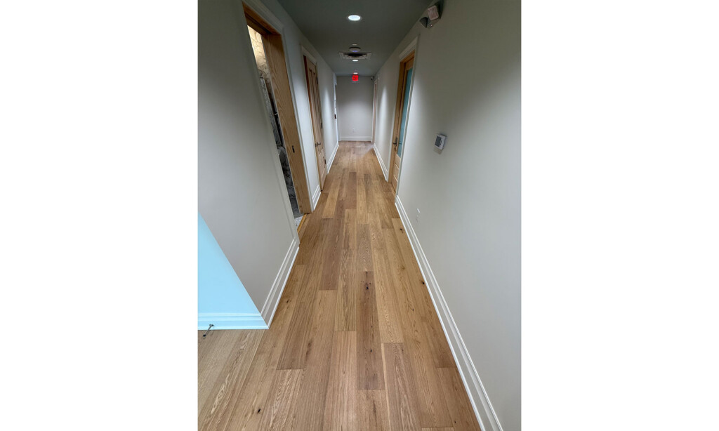 Long hallway at Winyah Dental Group with wood-look plank flooring installed by J&S Flooring in Georgetown, SC