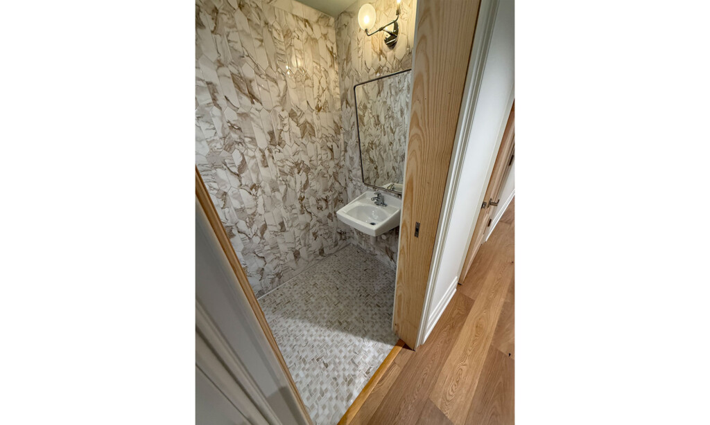 Winyah Dental Group restroom with stone-look wall tile and mosaic floor tile