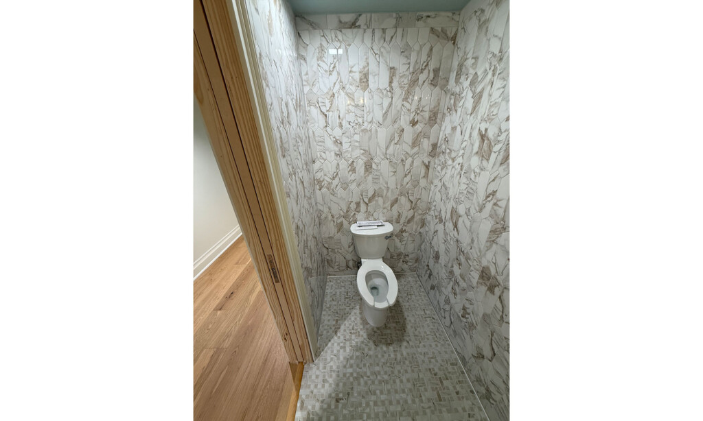 Winyah Dental Group restroom with floor-to-ceiling marble-look wall tile