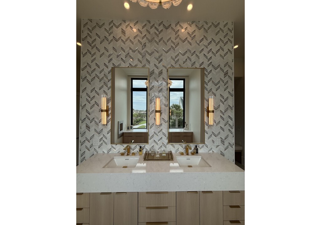 Woodward Project double vanity with herringbone wall tile and two mirrors