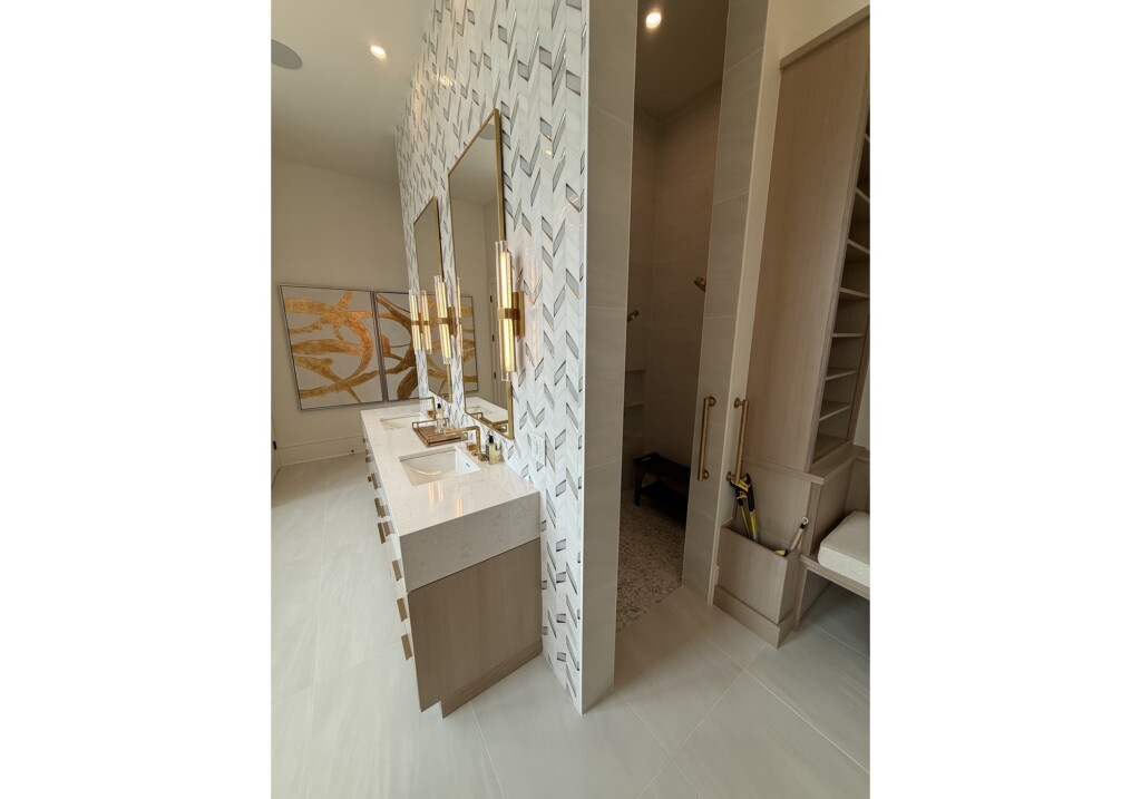 Woodward Project vanity with patterned wall tile beside walk-in closet