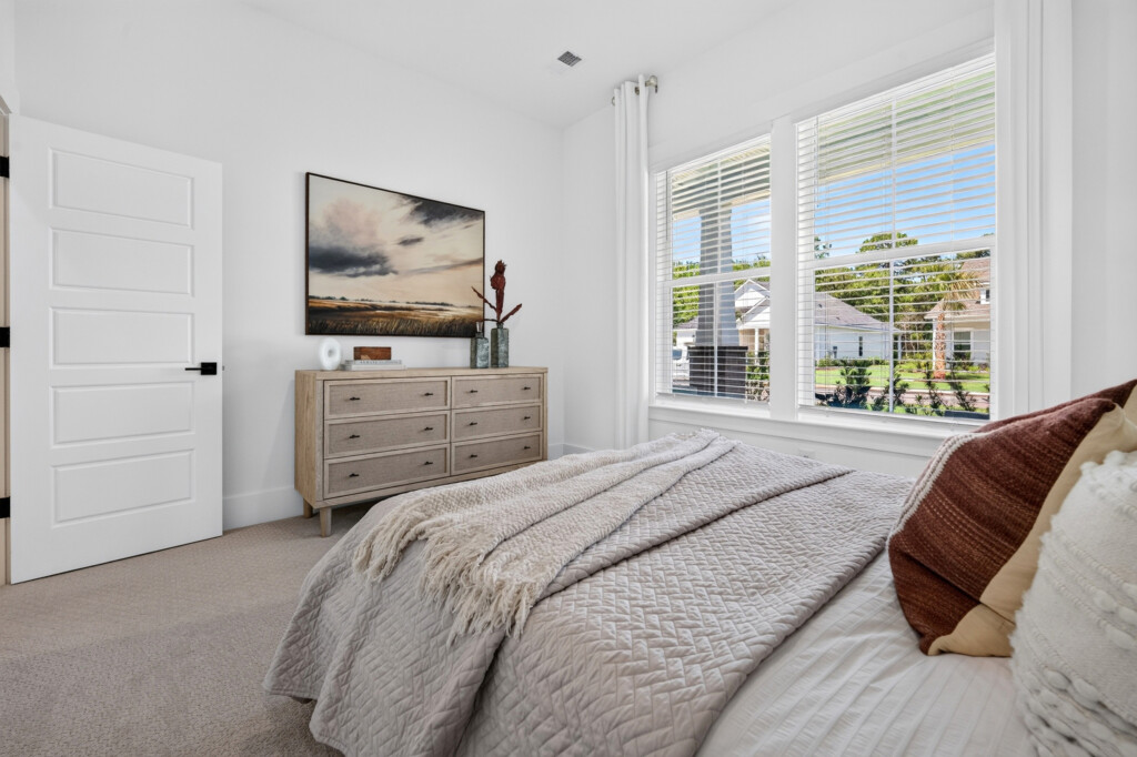 Sanderling Bay bedroom with neutral carpet and natural light