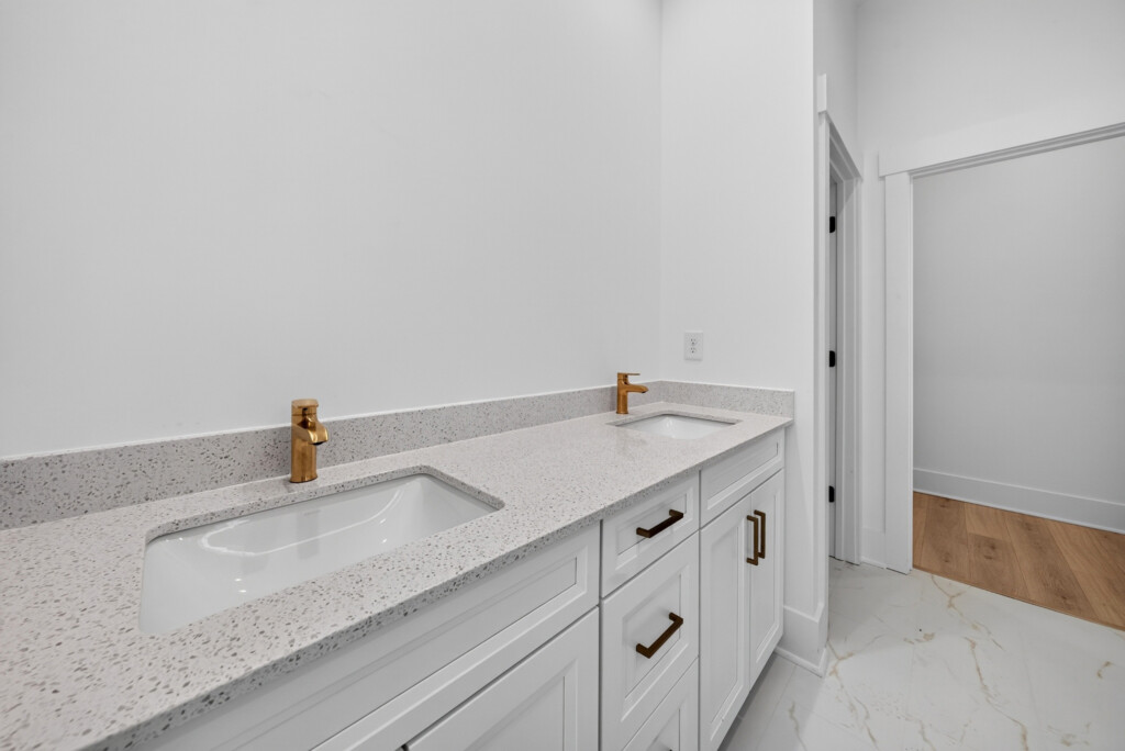 Bathroom vanity with marble-look porcelain floor tile