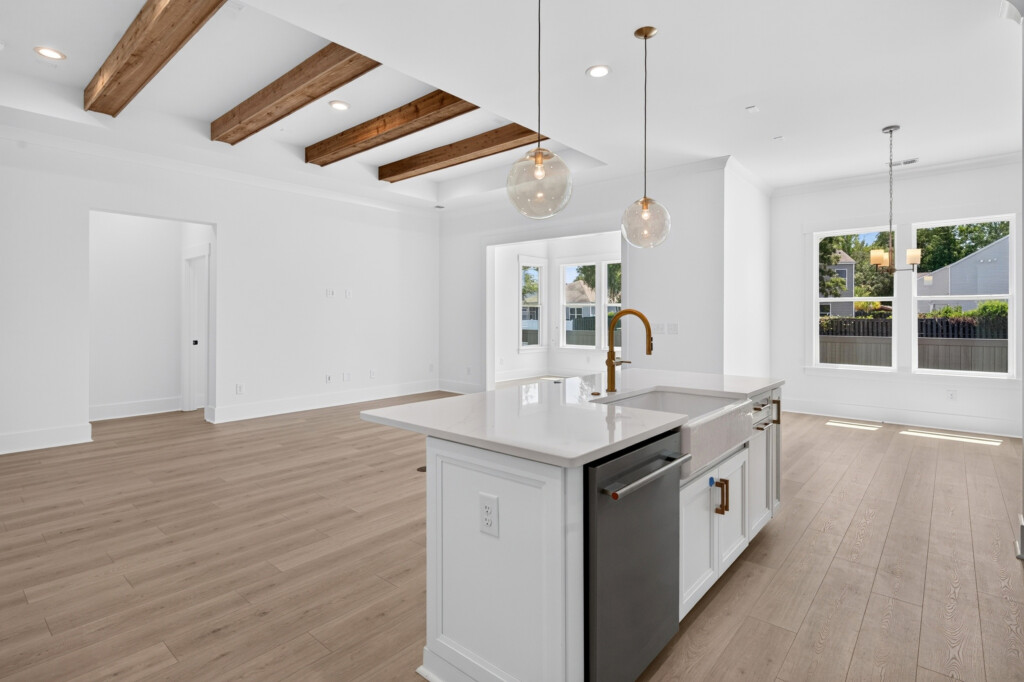 Kitchen island with farmhouse sink and pendant lights