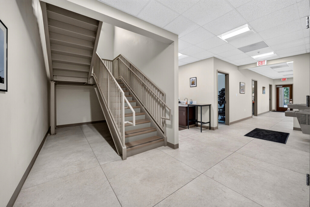 Zilmet USA stairwell and hallway with large-format porcelain floor tile