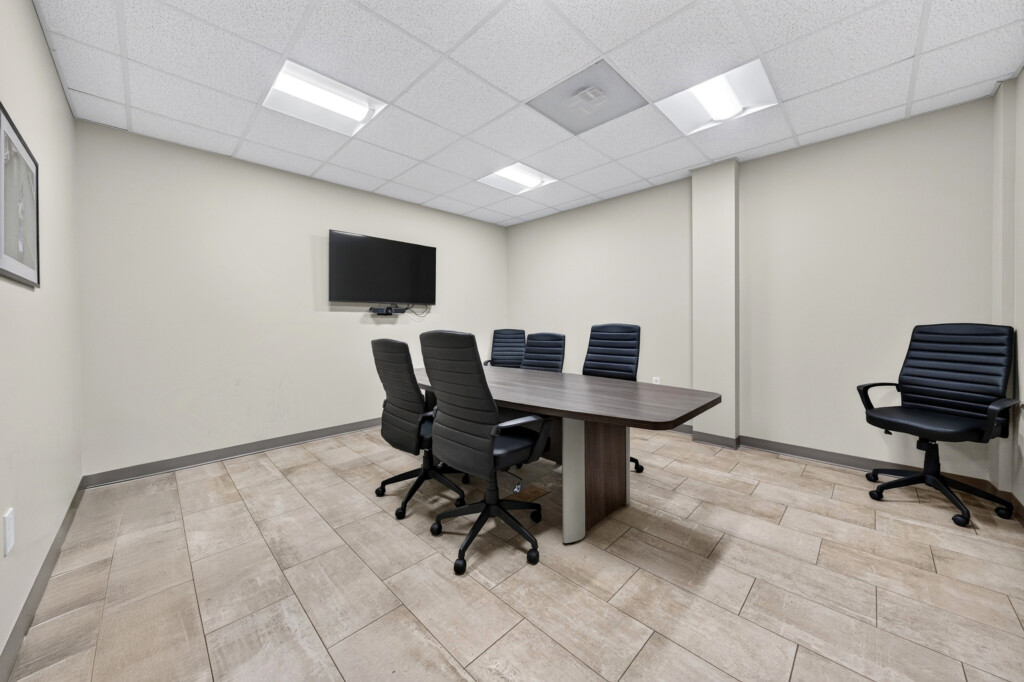Zilmet USA conference room with large-format porcelain floor tile, commercial tile installation by J&S Flooring