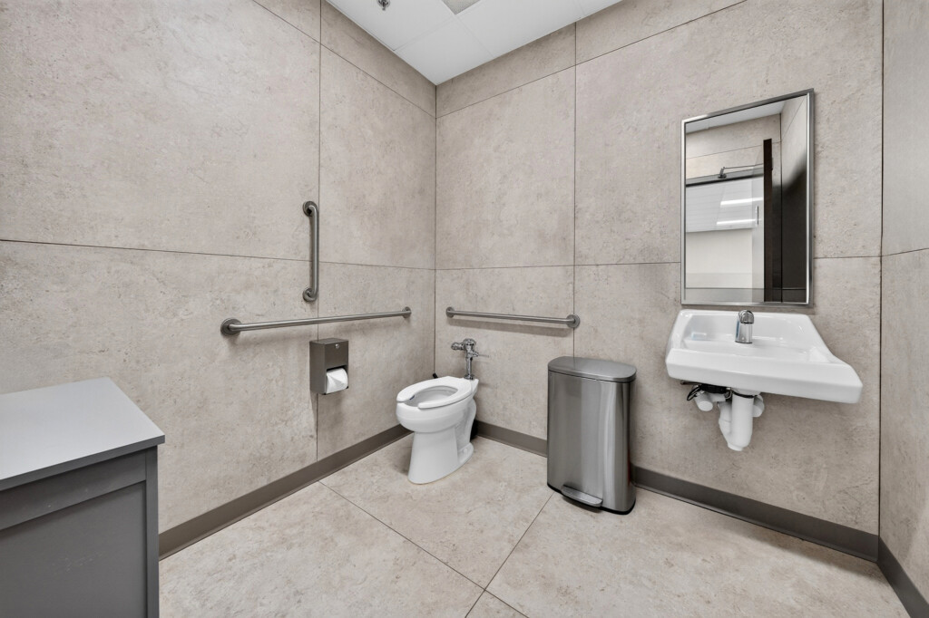 Zilmet USA ADA restroom with large-format porcelain wall and floor tile