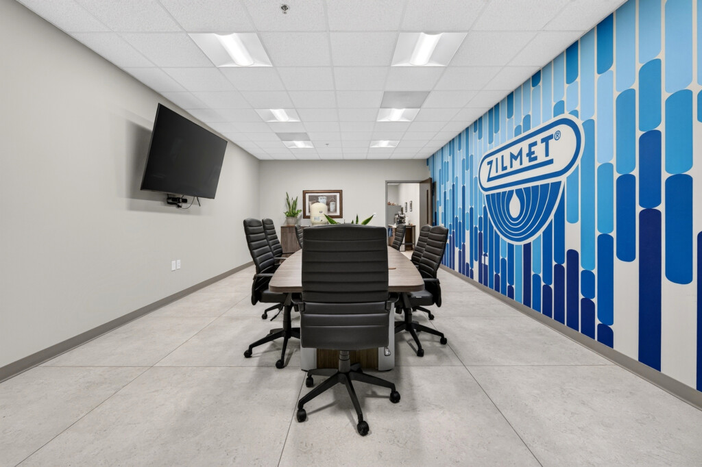 Zilmet USA conference table and TV with porcelain tile flooring
