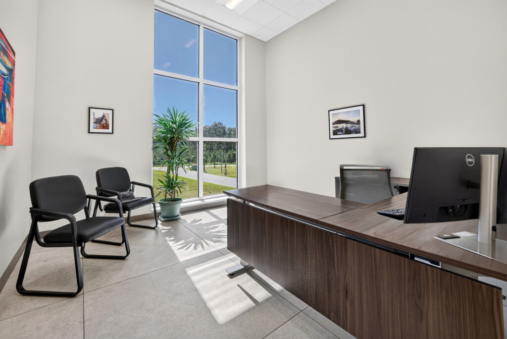 Zilmet USA office with desk, guest chairs, and porcelain tile flooring