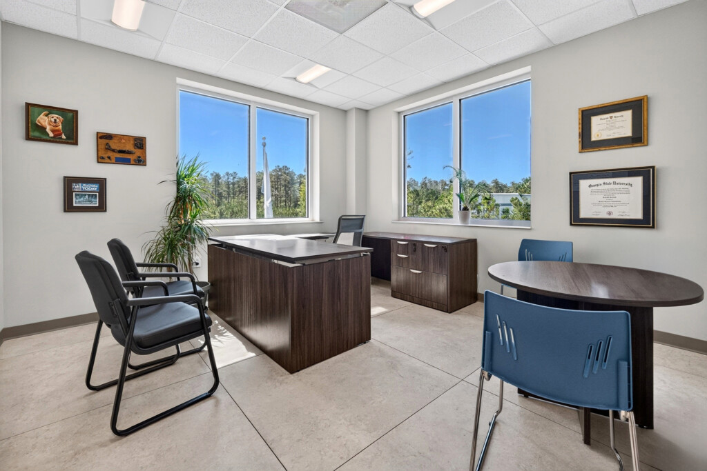 Zilmet USA executive office with round meeting table and porcelain tile floor